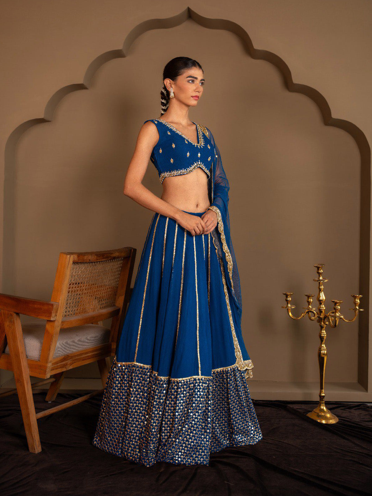 Buy designer faux georgette lehenga with paper mirror embroidered blouse, cancan flair and embroidered dupatta. Ideal for weddings and festive occasions.