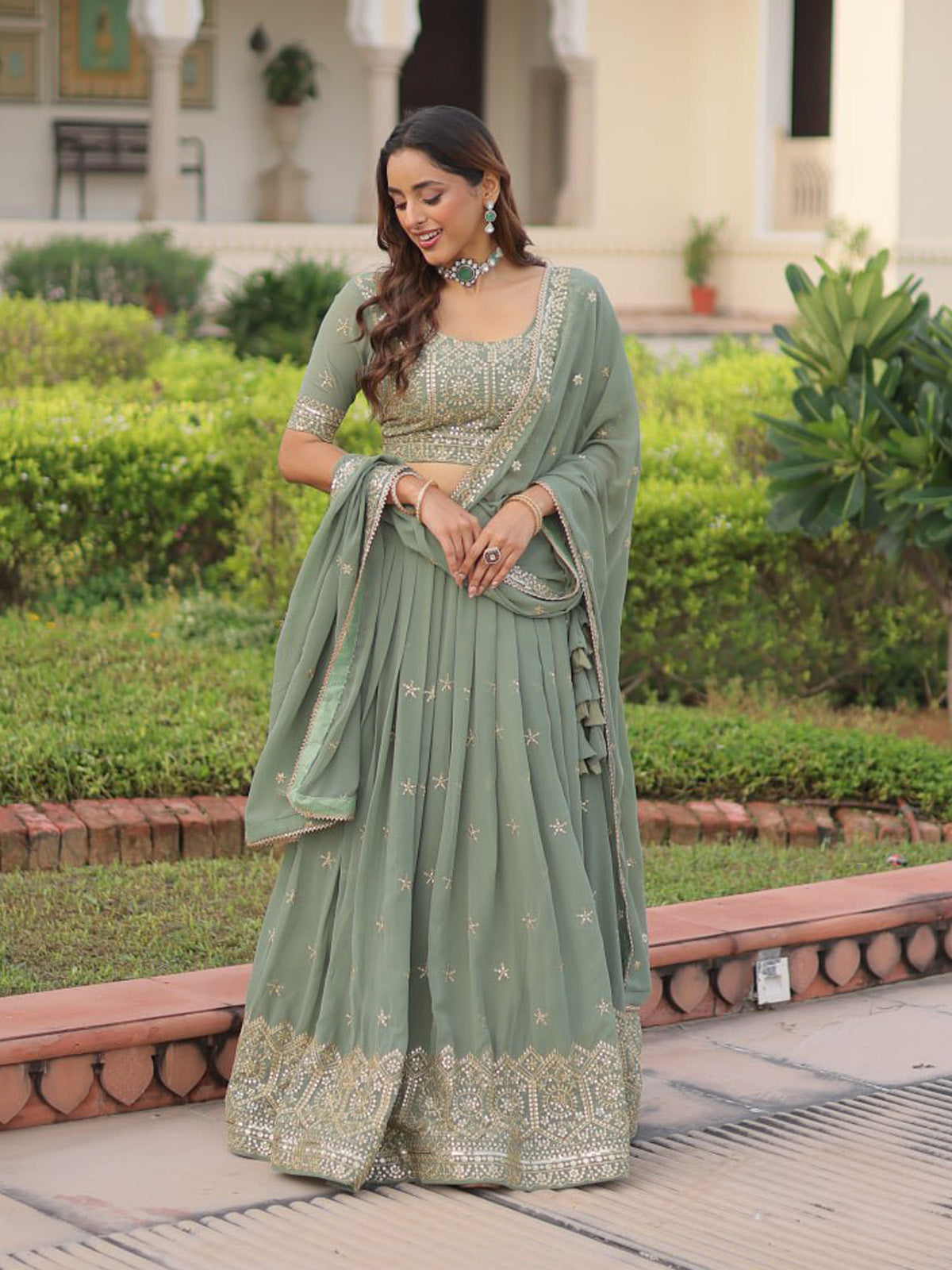 Discover FEALDEAL designer lehenga choli featuring sequins embroidery, nonwoven canvas flare and faux georgette dupatta. Shop wedding wear online.