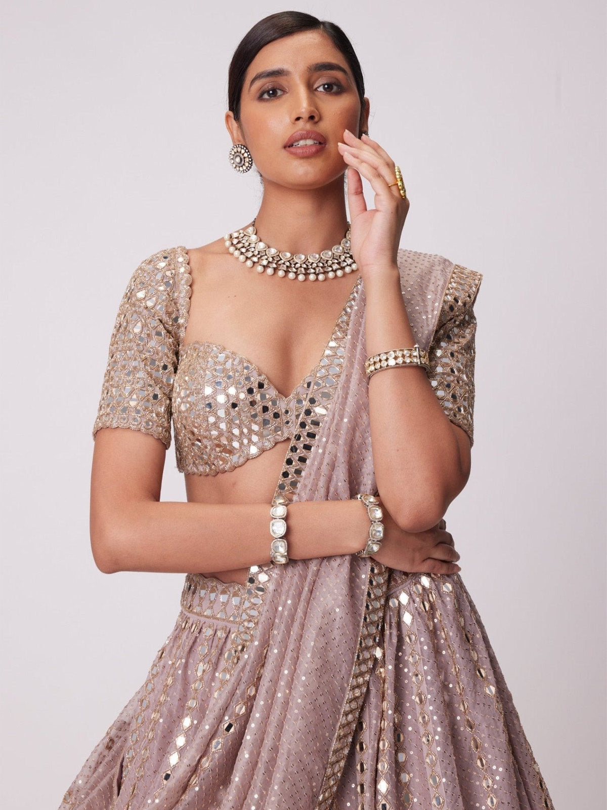 Elegant semi viscose organza lehenga choli with paper mirror, sequins and zari embroidery. Perfect for weddings, receptions, parties and festive occasions.