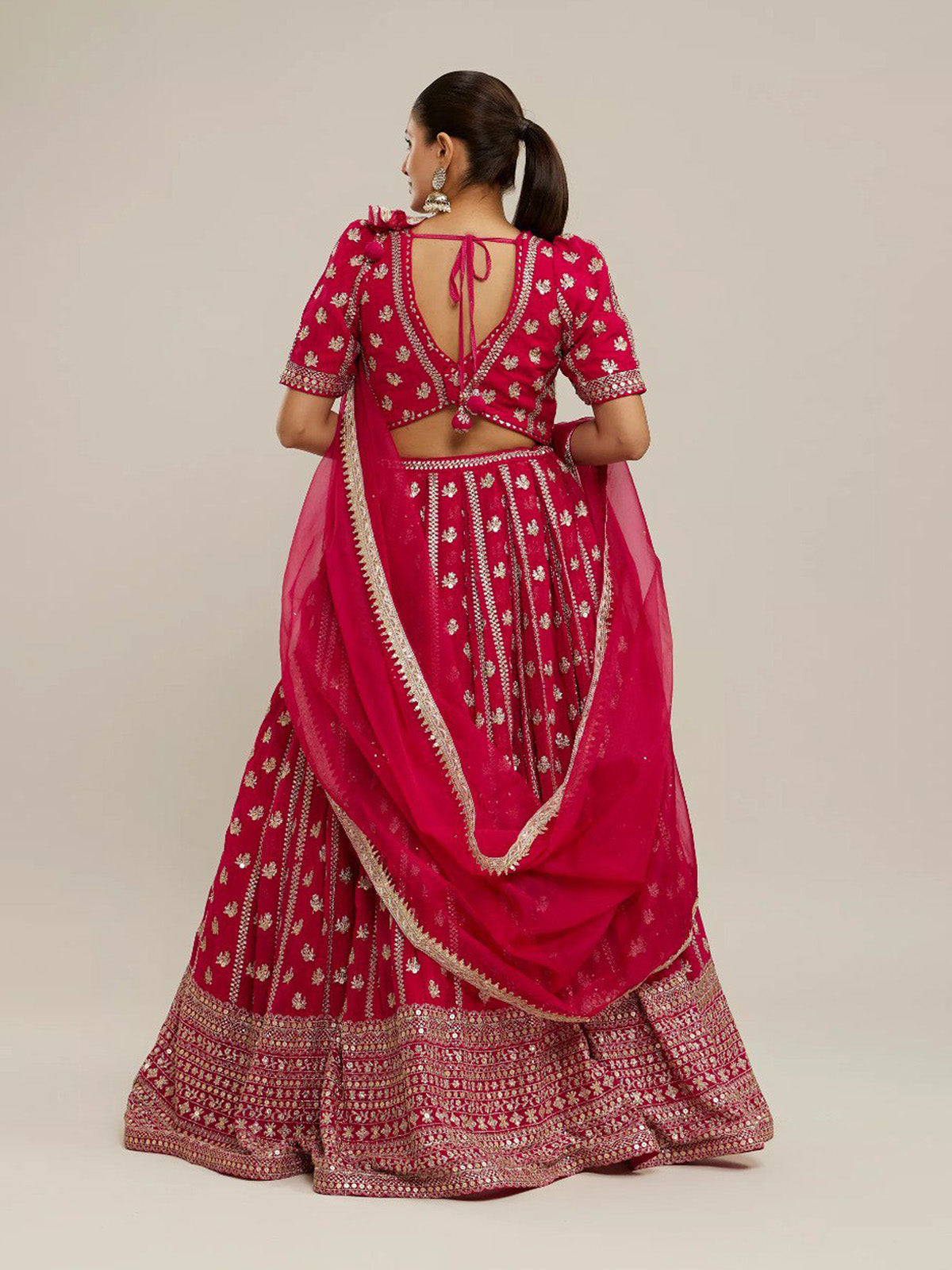 Discover FEALDEAL designer pink wedding lehenga choli with matte sequins, zari embroidery and elegant faux georgette dupatta.