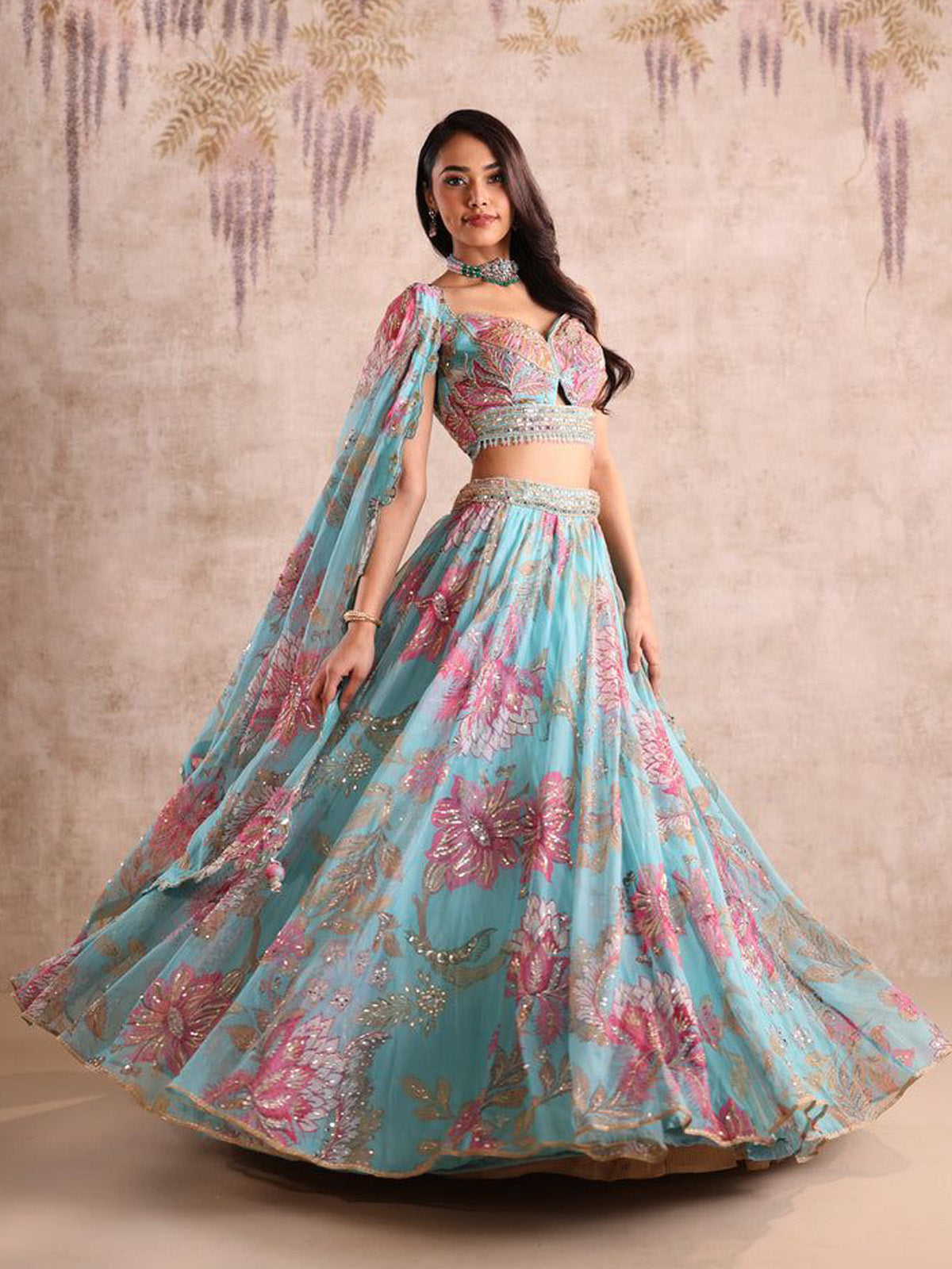 Buy a designer lehenga for wedding celebrations featuring premium Tabby Silk, beads, digital print work, 4m flare, customizable blouse and matching dupatta.