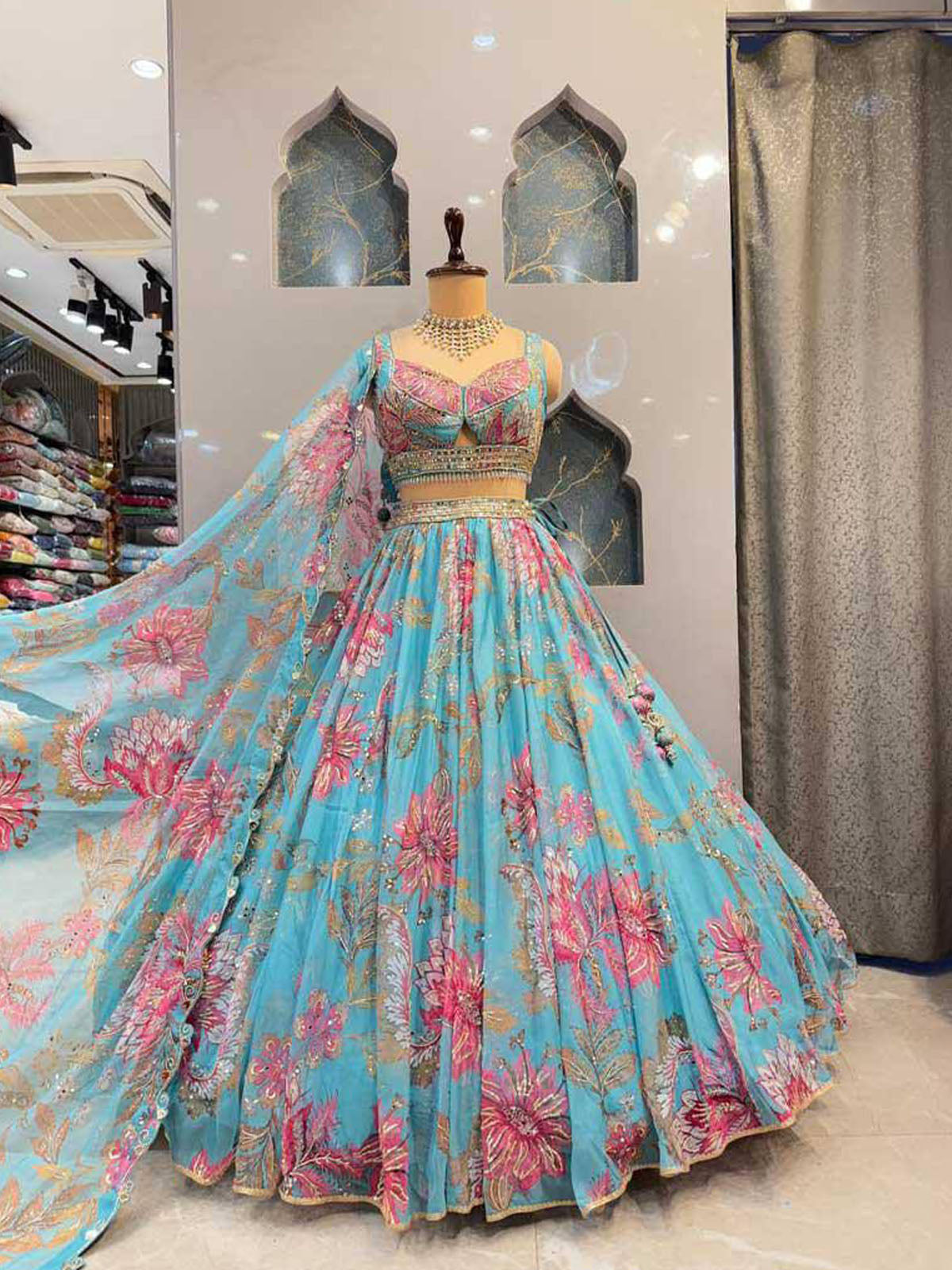 Elevate your ethnic look with a stylish Tabby Silk lehenga choli featuring bead work, digital prints, Cancan & Canvas flare and a matching 2.2m dupatta.