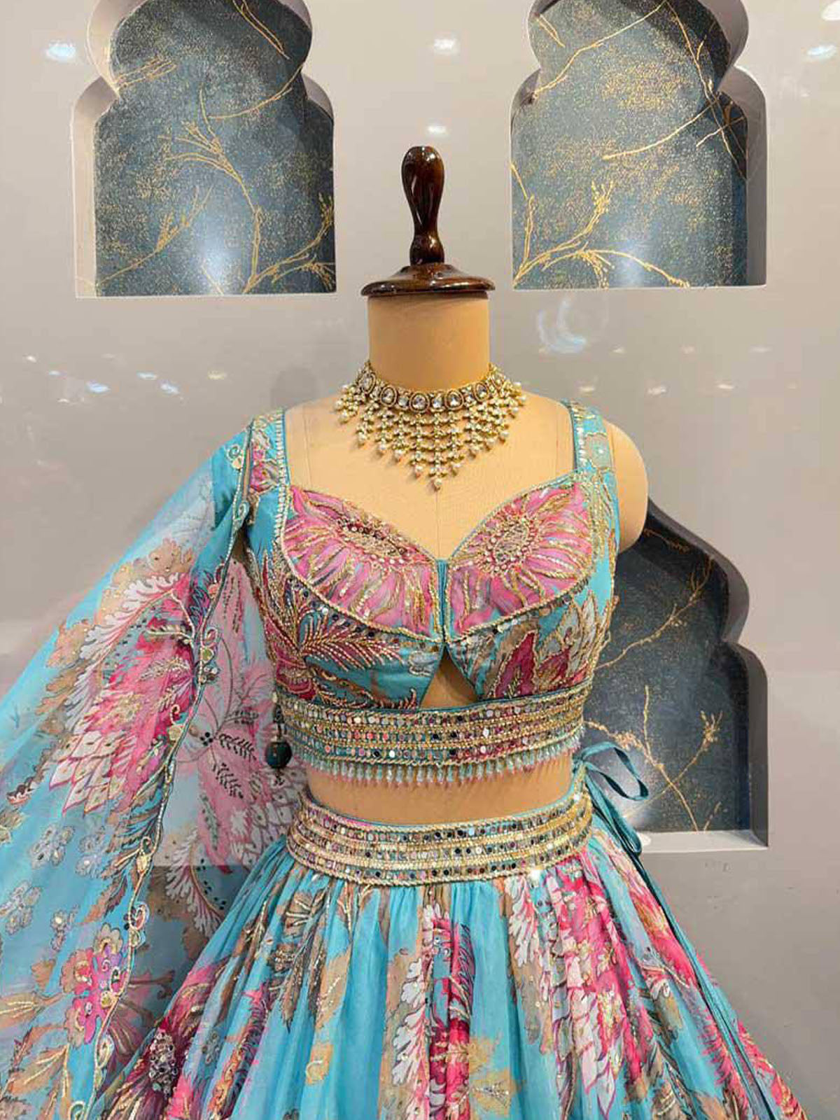 Explore a beautiful women lehenga choli set in premium Tabby Silk with bead and digital print work, semi-stitched flare, unstitched blouse and dupatta.