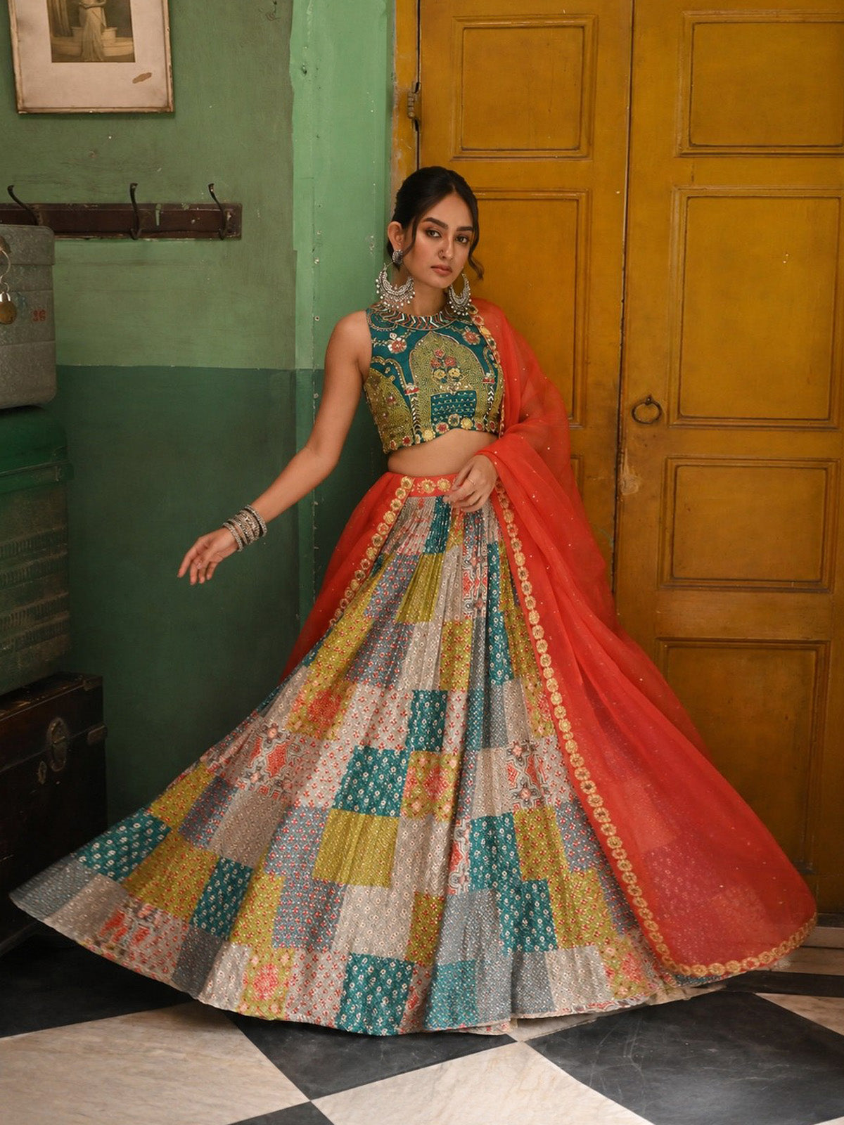 Discover a stylish Garba lehenga choli with multicolor printed silk, 3MM sequin work, 4.25m grand flare, embroidered blouse and Rust Organza dupatta.