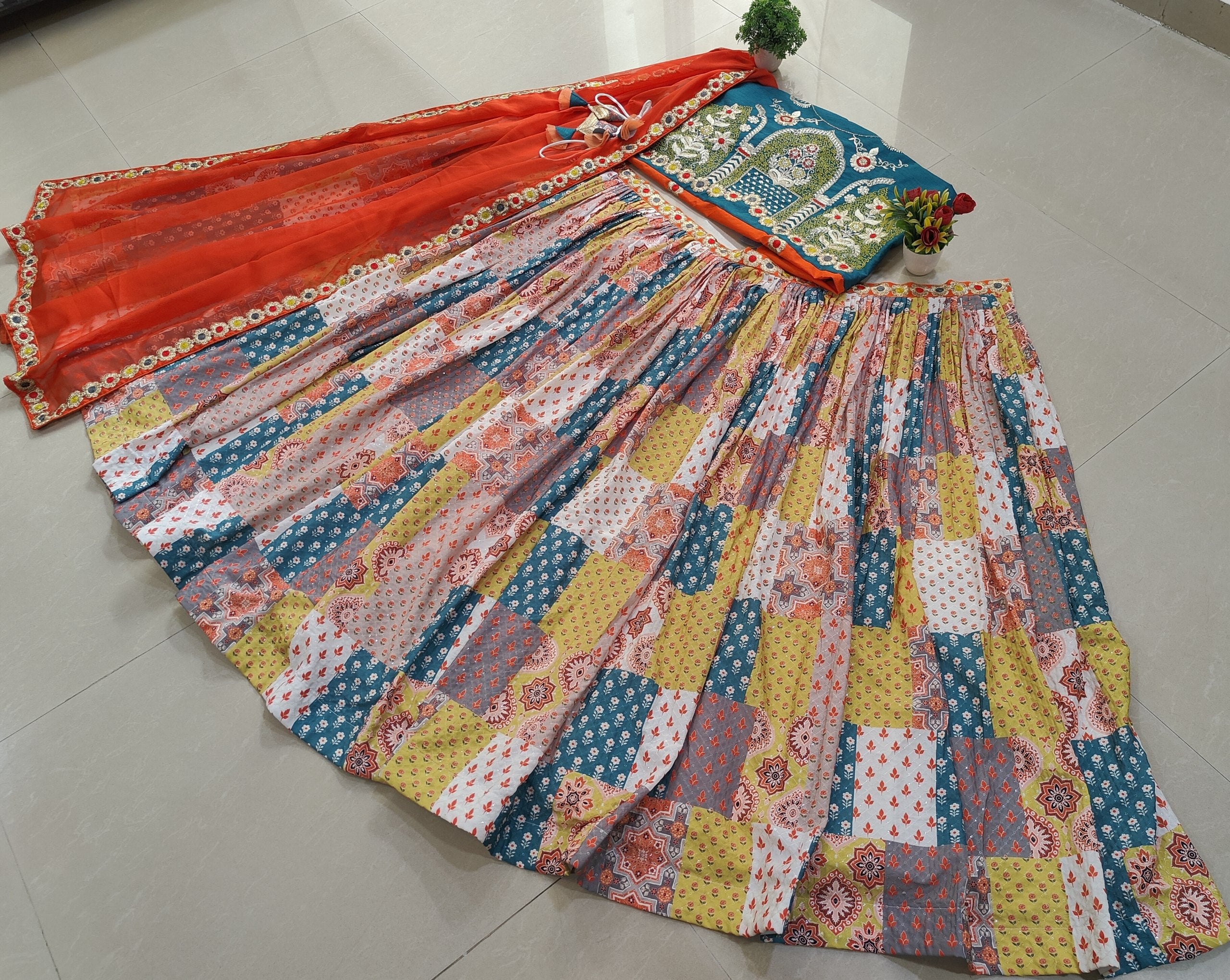 Shop this designer lehenga choli set for weddings and festivals with sequin embroidery, Rama-Rust blouse, 4.25m flare and a fully stitched Organza dupatta.