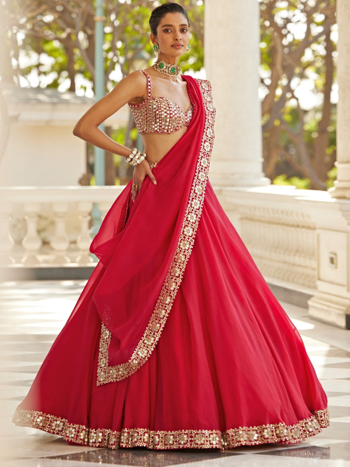 Shop FEALDEAL red Organza Silk lehenga choli with 5MM sequins, paper mirror and zari embroidery, 4.20m flare, blouse fabric, dupatta and tassels.