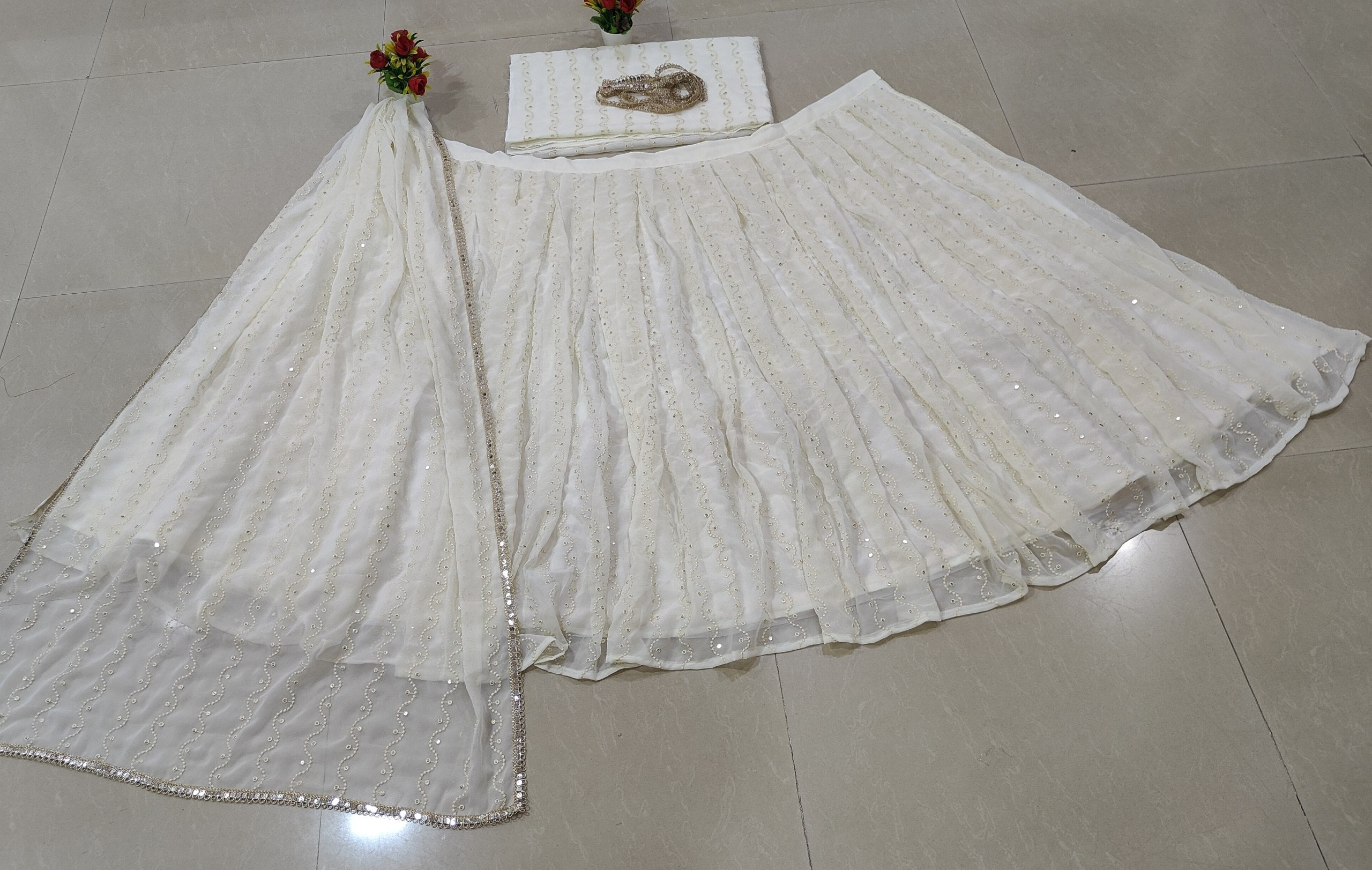 Upgrade your ethnic wardrobe with a Georgette lehenga choli featuring tone-on-tone thread embroidery, 4.25M flair and a fully stitched dupatta.