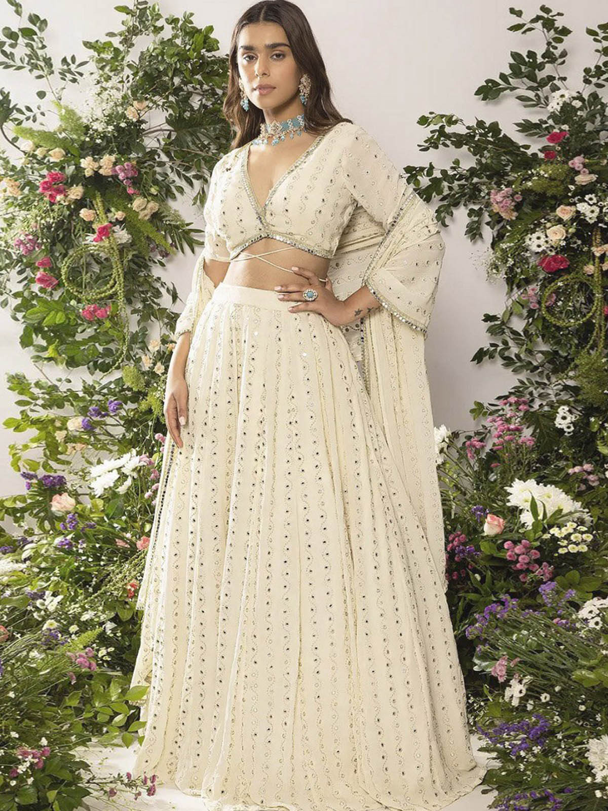 Buy a designer lehenga choli set for weddings and festive occasions featuring Faux Georgette, sequin embroidery, Cancan, Canvas and handmade tassels.