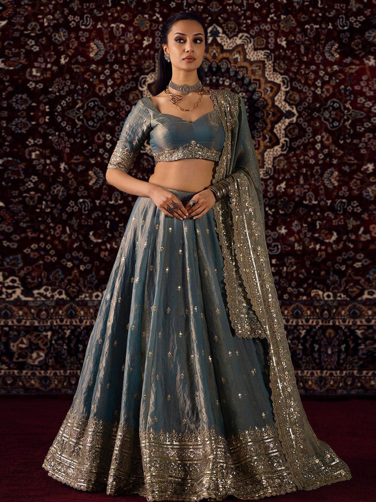 Discover an elegant wedding lehenga for women and girls in Gold Shading Silk with 5MM & 3MM sequins, Zari embroidery and graceful 3.6M flair.