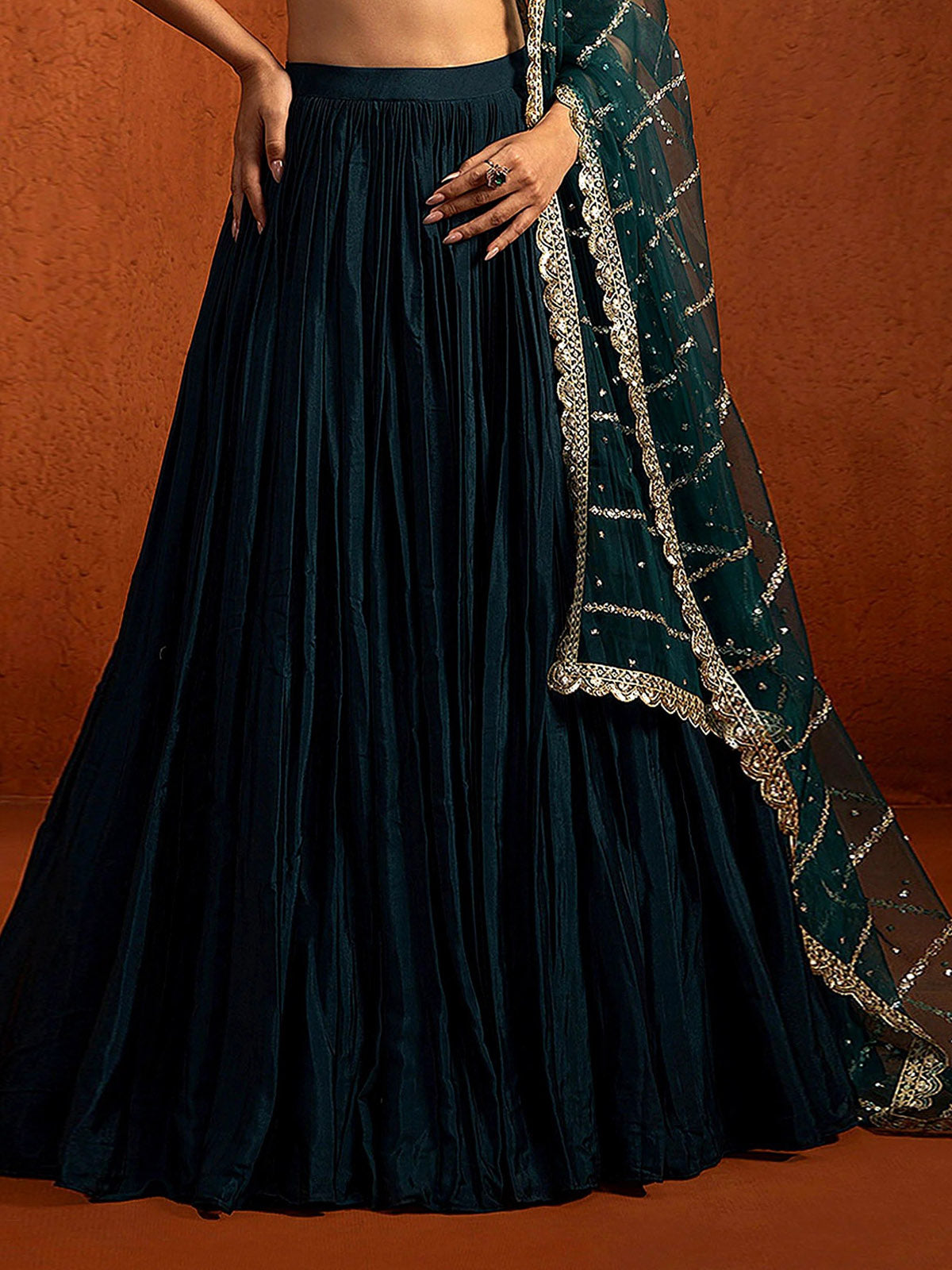 Elegant lehenga for women with 5.80M flair, Chinon Silk fabric, embroidered choli, fully stitched net dupatta and handmade tassels subject to availability.