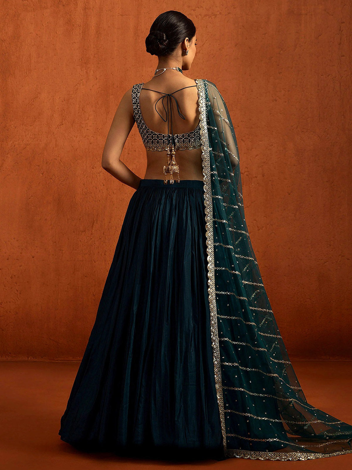 Discover a stunning wedding lehenga with Chinon Silk, 5MM & 3MM sequin embroidery, 5.80M flair and a fully stitched 2.30M net dupatta.