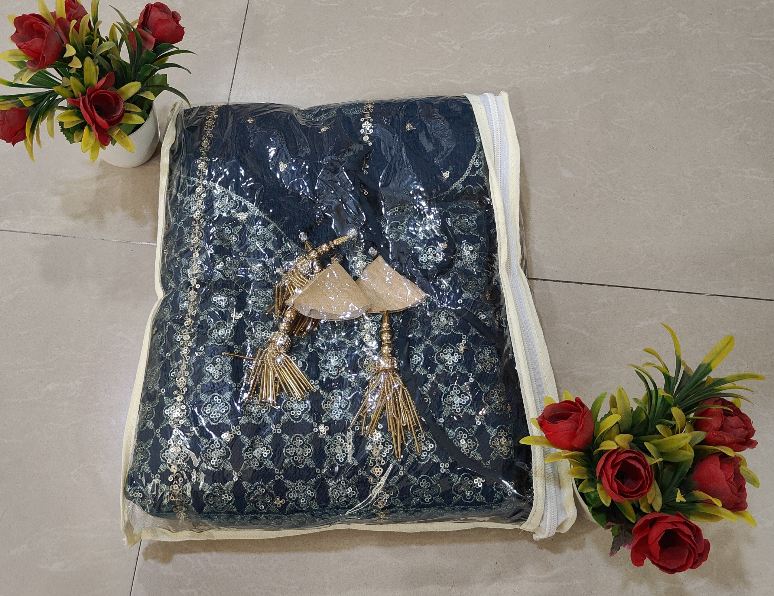 Style this elegant wedding lehenga choli set with a 5.80M flared Chinon Silk lehenga, embroidered blouse fabric and a fully stitched net dupatta.
