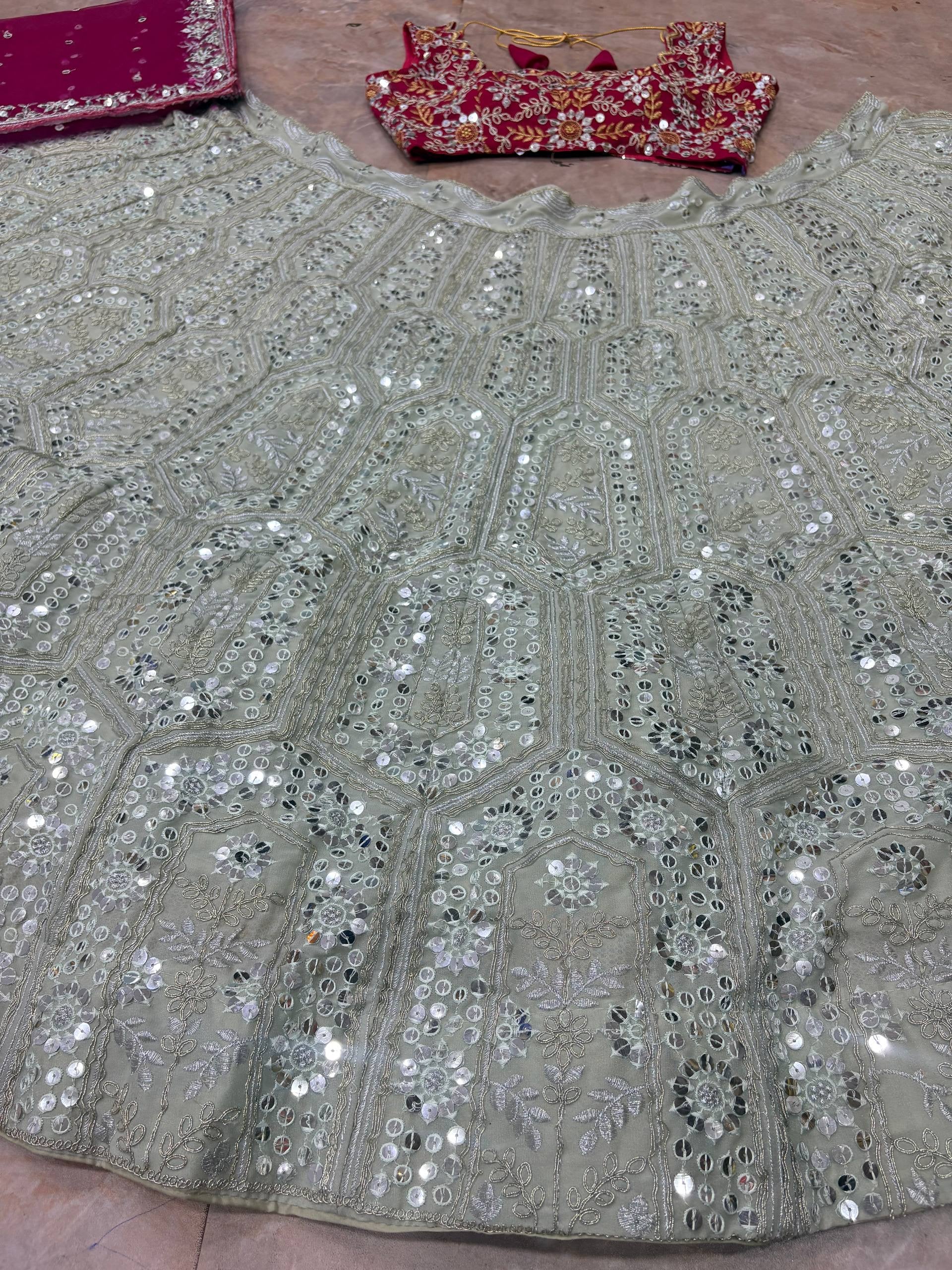 Choose FEALDEAL for a stylish women lehenga choli featuring premium Faux Georgette, sequins embroidery and a grand 3.5m flare. Great for wedding celebrations.