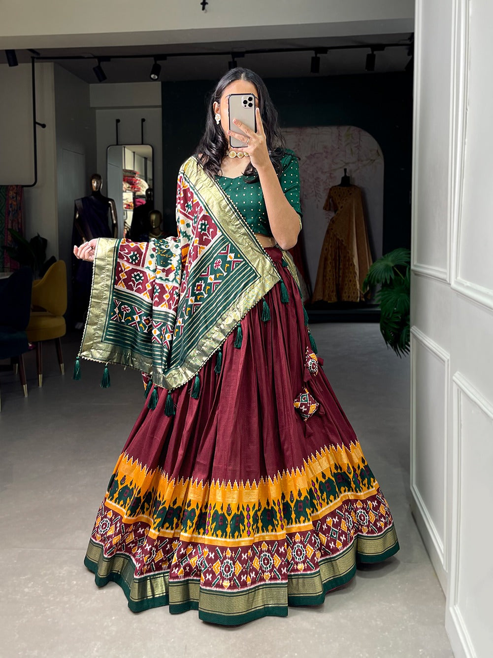 Woman in a traditional maroon and green chaniya choli for wedding,
cotton chaniya choli for navratri,
rajasthani chaniya choli,
chaniya choli song download,
surat chaniya choli wholesale market,
simple chaniya choli for navratri,
gujrati chaniya choli,