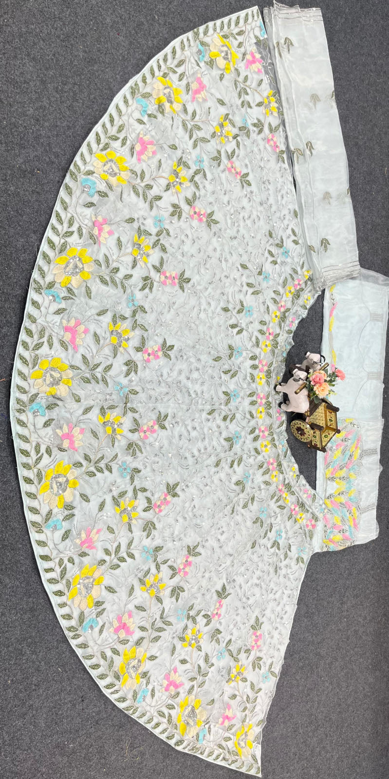 Premium organza silk lehenga choli dress with sequins cutwork dupatta. Ideal lehenga for women weddings, parties & festive occasions. Buy now from FEALDEAL.