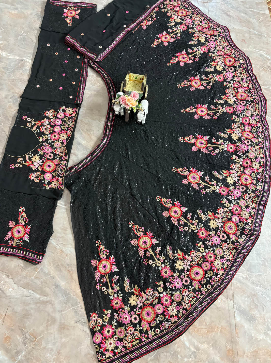 Elegant pastel color lehenga design with 4-meter flare & embroidered blouse. Perfect lehenga for women weddings & festive functions.