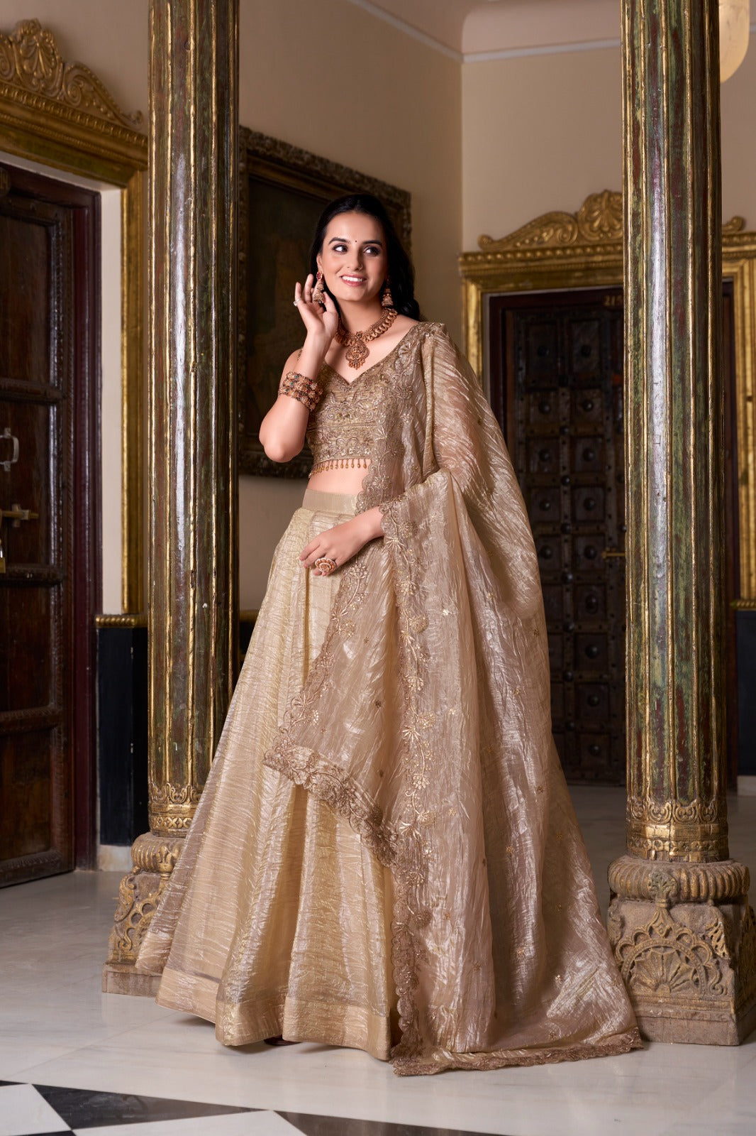 Shine in FEALDEAL Golden Crushed Lehenga Choli. Elegant wedding lehenga choli crafted in crushed georgette for festive & bridal occasions.