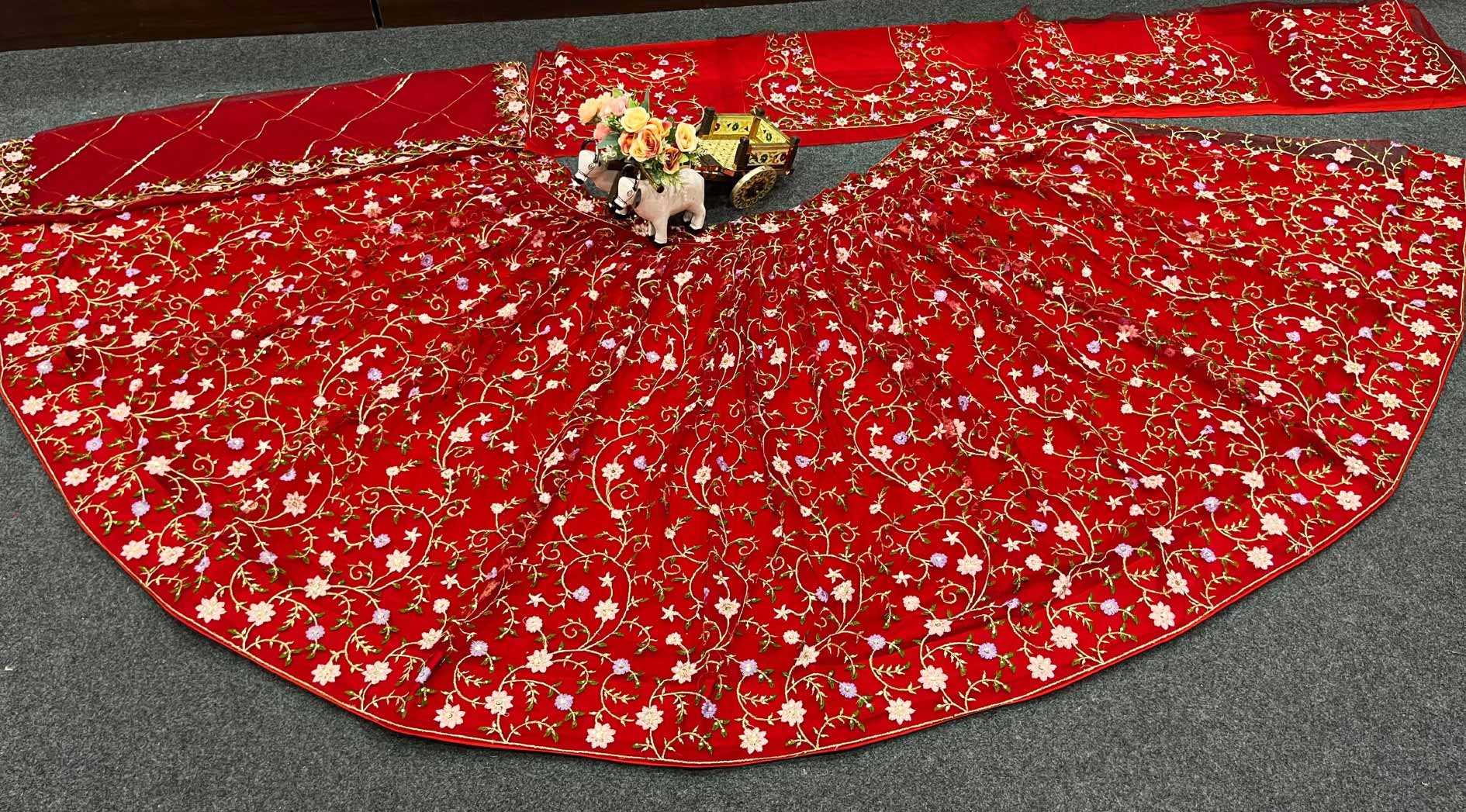 Red color soft net embroidered lehenga choli for women