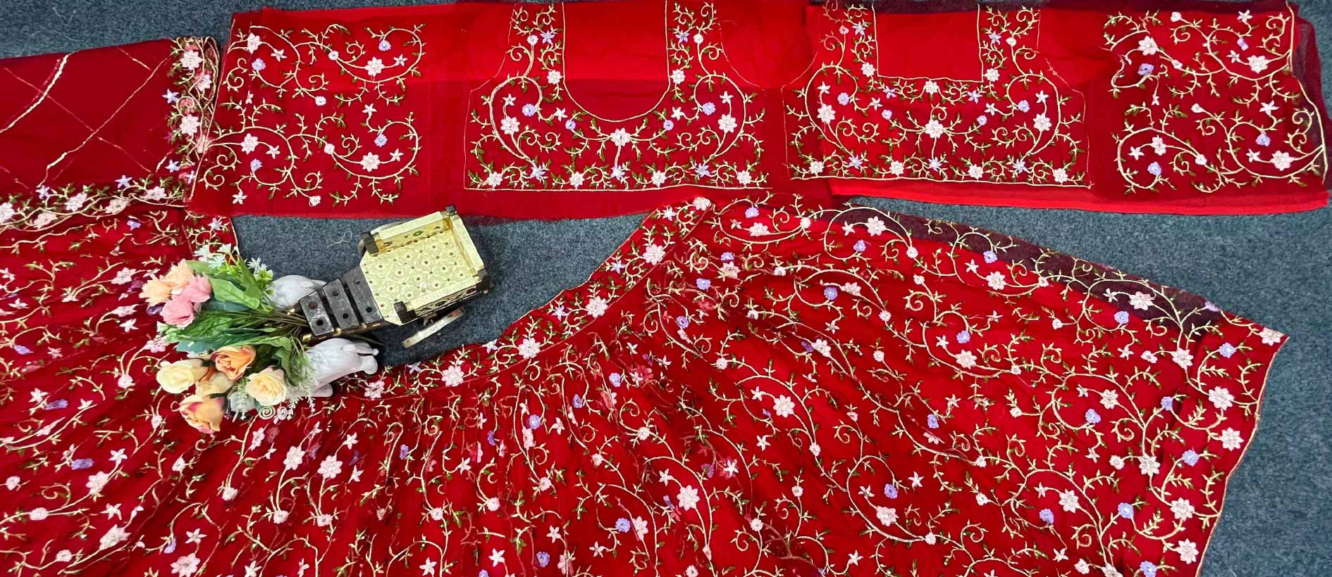 Red color soft net embroidered lehenga choli for women