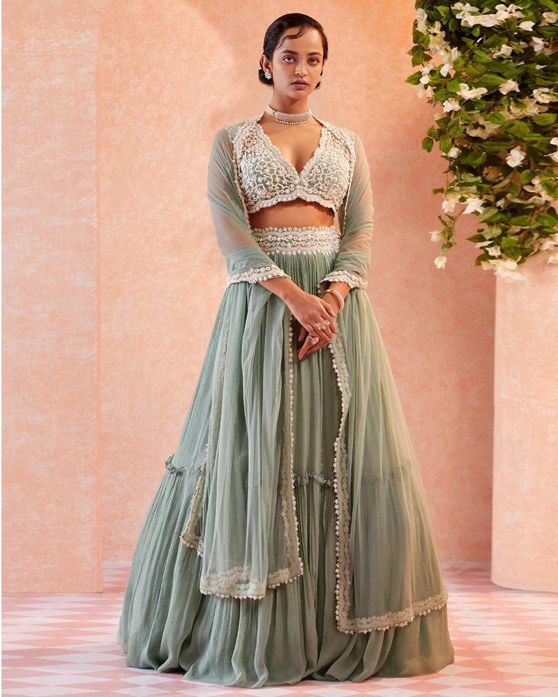 Lehenga choli with long skirt, Lehenga choli for sangeet, Lehenga dupatta, Velvet lehenga, Lehenga with mirror work, Lehenga with stone embellishments, Lehenga with patchwork, Lehenga with thread embroidery, Indian traditional attire, Ethnic wear, Lehenga choli with gota patti work, Lehenga choli with bandhani print