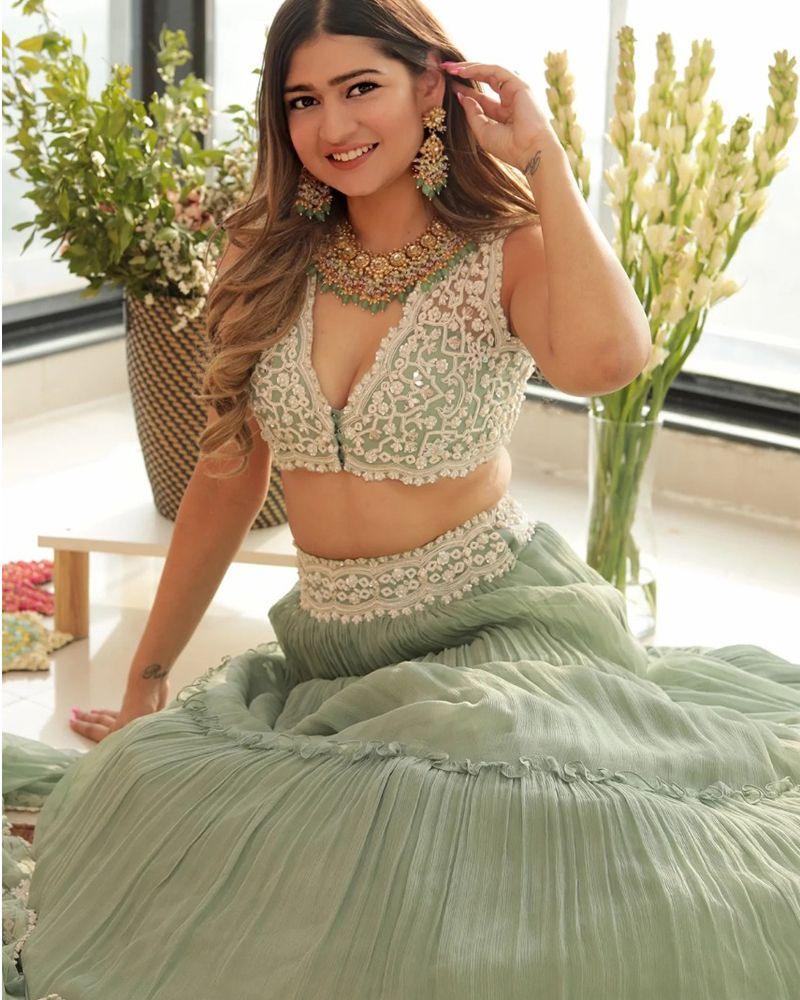 Lehenga choli with long skirt, Lehenga choli for sangeet, Lehenga dupatta, Velvet lehenga, Lehenga with mirror work, Lehenga with stone embellishments, Lehenga with patchwork, Lehenga with thread embroidery, Indian traditional attire, Ethnic wear, Lehenga choli with gota patti work, Lehenga choli with bandhani print