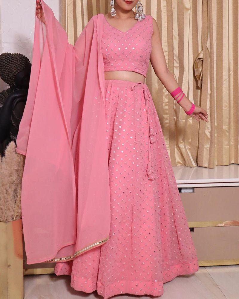 Lehenga choli with floral motifs, Lehenga choli with thread work, Lehenga choli with hand-painted designs, Lehenga choli with brocade fabric, Lehenga choli with velvet fabric, Lehenga choli with net fabric, Indian traditional wear, Ethnic attire, Indian bridal outfit, Lehenga with heavy embroidery