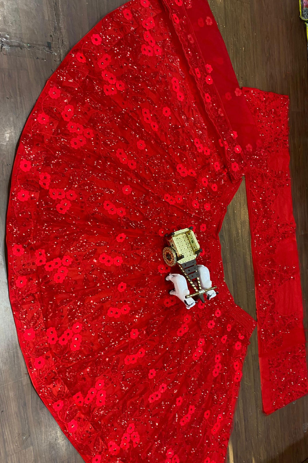 Looking for a wedding lehenga choli? FEALDEAL brings you a sequins embroidered butterfly net lehenga with blouse & dupatta for women and girls at the best price.