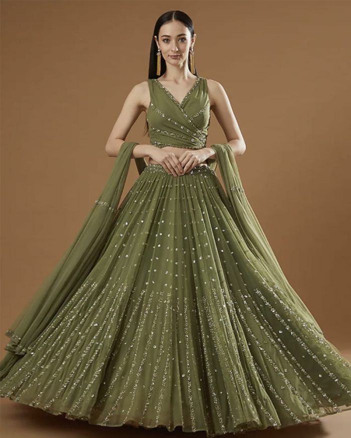 Bridal lehenga paired with brown color heavily embellished choli